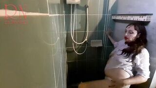 Nice lady in the shower in wet clothes and a hat. Striptease dancing in the shower. 1 - 12 image