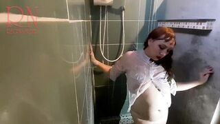 Nice lady in the shower in wet clothes and a hat. Striptease dancing in the shower. 1 - 13 image