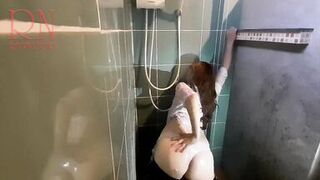 Nice lady in the shower in wet clothes and a hat. Striptease dancing in the shower. 1 - 8 image